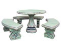 Decorated stone garden furniture table and chairs isolated over white