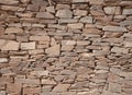 Decorated stone wall in the garden of a villa in Sardinia