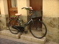 A decorated stoped bicycle in front of a house in France. Royalty Free Stock Photo