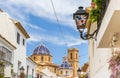 Decorated street light in front of the cathedral in Altea Royalty Free Stock Photo