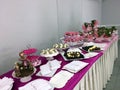 Decorated table in pink full of candies, girl celebration