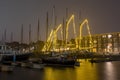 Decorated traditional sailing ships in the harbor from Harlingen in Netherlands in christmastime at night