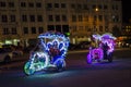 Decorated trishaw with colorful flowers and doll for hire at Malacca city, Malaysia Royalty Free Stock Photo