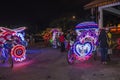 Decorated trishaw with colorful flowers and doll for hire at Malacca city, Malaysia Royalty Free Stock Photo