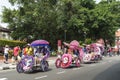 Decorated trishaw with colorful flowers and doll for hire at Malacca city, Malaysia Royalty Free Stock Photo