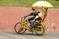 A decorated trishaw or tricycle rickshaw in historical Malacca or Melaka, Malaysia