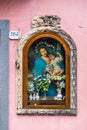 Votive shrine of Virgin Mary on a house wall, Zafferana Etnea, Italy Royalty Free Stock Photo