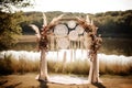 Decorated wedding arch in boho style with dream catchers in early autumn near the lake or river. Generative AI