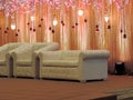 Decorated wedding reception stage at traditional Hindu wedding, India