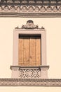 Decorated window of an Italian villa.