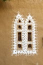Decorated windows of a loam hut Royalty Free Stock Photo