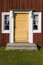 Decorated yellow entrance door Royalty Free Stock Photo