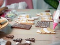 Decorating christmas gingerbread cookies with white glaze