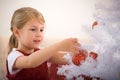 Decorating a christmas tree Royalty Free Stock Photo