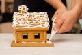 Decorating, cooking, slaking a gingerbread house. Preparation for Christmas Royalty Free Stock Photo