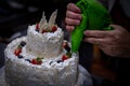 Decorating cream cake and fruits Royalty Free Stock Photo