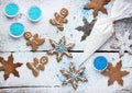 Decorating gingerbread man and snowflake Christmas cookie background, Christmas treats for kids cooking process