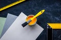 Decorating and house renovation tools and accessories on black stone table background top view mockup Royalty Free Stock Photo