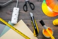 Decorating and house renovation tools and accessories on wooden table background top view Royalty Free Stock Photo