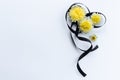 Decoration from black funeral ribbon with yellow flowers.