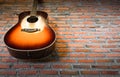 Decoration brick wall with folk guitar Royalty Free Stock Photo