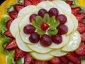 decoration of a cake with slices of various fruits, background and texture