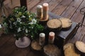 Decoration with candles and flowers on a dark wooden background