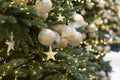 Decoration with a Christmas tree decorated with a golden ball and a star. Sparkling shining festive new year background