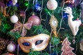 Decoration on a Christmas tree in the form of carnival mask