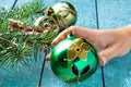 Decoration for Christmas tree, vintage ball in a female hand