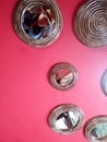 Decoration and design of red wall with mirrors and reflection of woman with hat