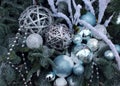 Decoration, DIY, New year`s composition of festive balloons, various tinsel on spruce branches in blue tones, close-up, top view