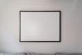 Decoration empty black square frame, poster, white canvas mock up on a gray wall, front view Royalty Free Stock Photo