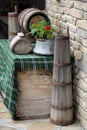 Decoration in the garden. Traditional Bulgarian appliances used in the past - old butter churn , wooden cask and caludron Royalty Free Stock Photo