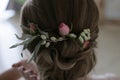 Decoration in the hair of a woman from small pink roses, small white flowers and fruits Elaeagnus commutata Royalty Free Stock Photo