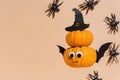 Decoration for Halloween kids party - flying cute pumpkin head with eyes and funny face. Pumpkin monster, witch, vampire, crawling