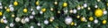 Decoration hanging from a christmas tree. Gold and silver balls hanging on the green Christmas tree closeup. Royalty Free Stock Photo