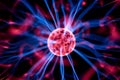 Decoration lamp in shape of plasma ball with red and blue electrodes, close-up Royalty Free Stock Photo