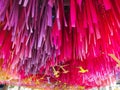 Decoration multi color hanging long paper on ceiling. yellow plastic birds hanging for decoration. vivd pink and violet color Royalty Free Stock Photo