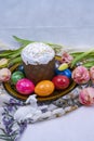 Decoration with Orthodox Easter cake, Easter eggs, tulips and ceramic lamb. Royalty Free Stock Photo