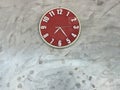 Decoration of red clock on the background wall, interior concept Royalty Free Stock Photo