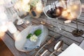 Decoration on a rustic wooden table for a romantic dinner Royalty Free Stock Photo