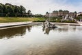 old big baroque fountain made of white marble. Beautiful fountain with antique sculptures in the park Royalty Free Stock Photo