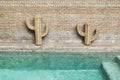 Decoration of swimming pool with wooden wicker straw cactus Royalty Free Stock Photo