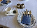 Decoration of table in a blue-white tone, beautiful white cup