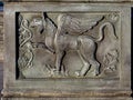 Decoration of walls or hedges in the form of a bas-relief with the image of a griffin Royalty Free Stock Photo