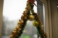 Decoration on window. Garland on glass. Decorating house