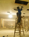 Decoration workers spruce up the ceiling