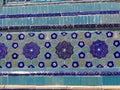 Blue ceramic flowers decorations on a religious buildingl in Uzbekistan.