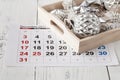 Decorations and calendar with Christmas Day marked out Royalty Free Stock Photo